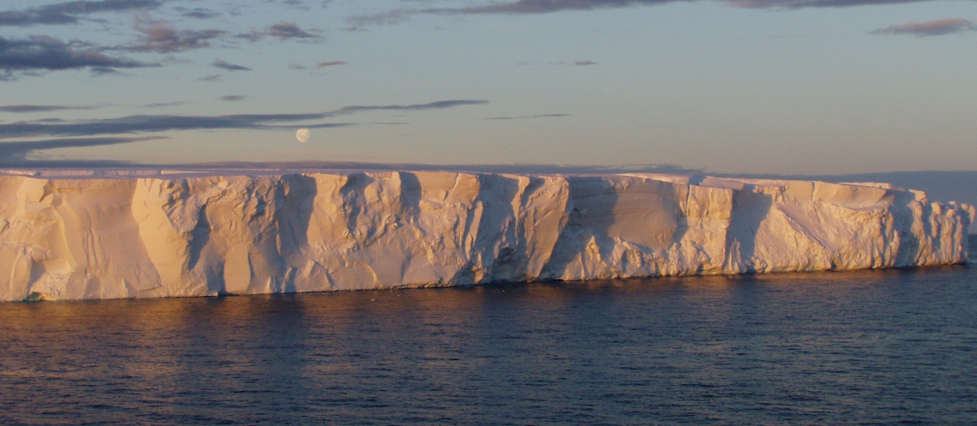 Iceberg at sunset in Southern Ocean with pastel colours