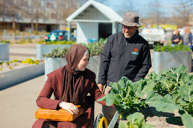 Jeff McClintock Community Garden Coordinator with student